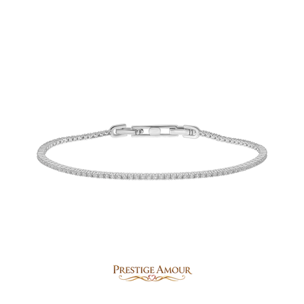 A wrist wearing a silver tennis bracelet against a dark sleeve